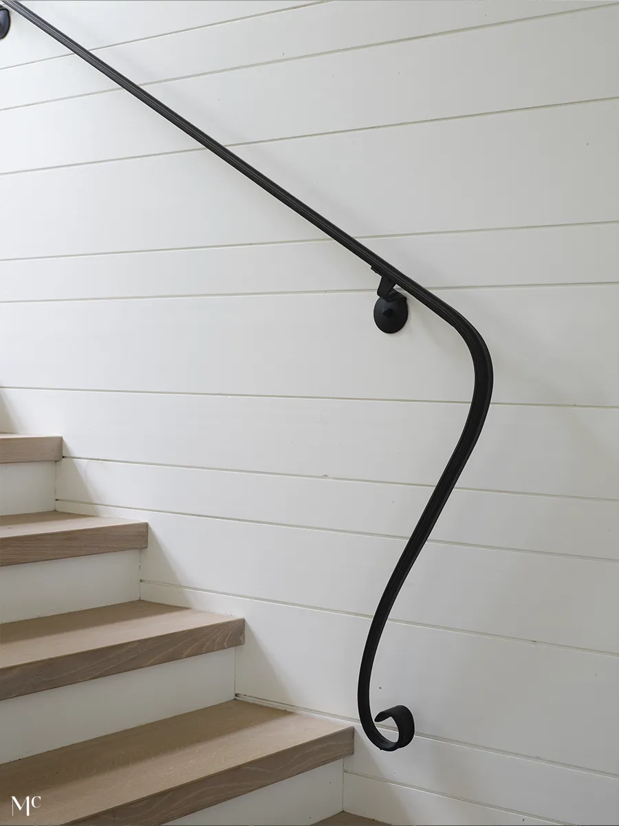 White walls with thin black railing