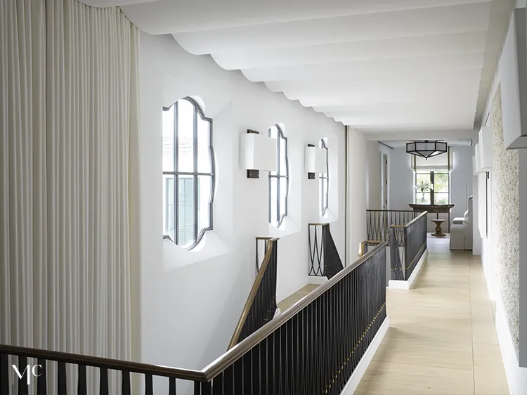 long white hallway with wood floors