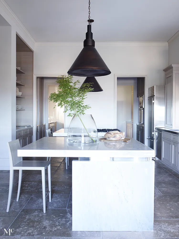 A large kitchen with white walls