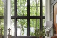 A modern farmhouse-style living room with large windows